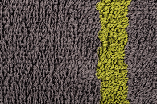 Dark textured natural fibres abstract backgrounds with yellow accent