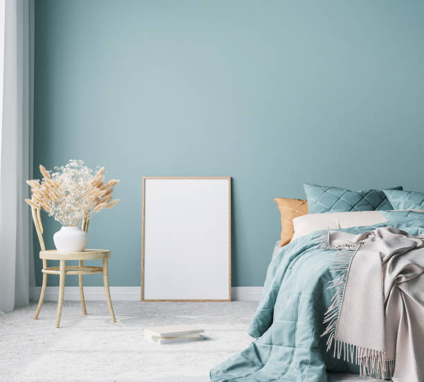 istock Blue Scandinavian bedroom with vertical frames in bright design, poster mock up on boho wall background 1300125315