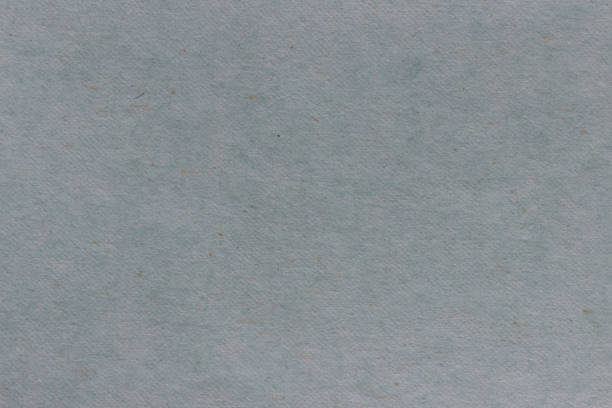 istock Texture of rough gray paper with spots 1300125325