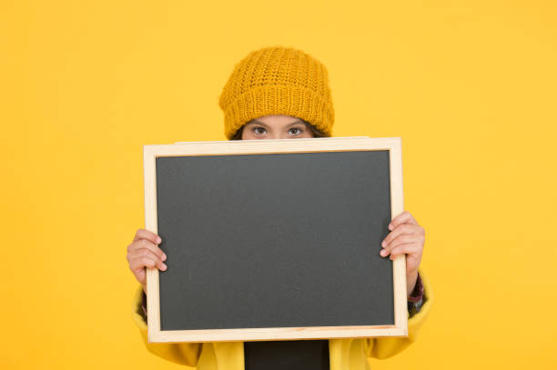 istock Only relevant information. Modern schoolgirl with chalkboard. School schedule information. School girl cute pupil hold blackboard copy space. School announcement concept. Changes in school life 1300125895