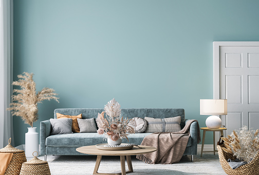 Maqueta interior del hogar con sofá azul, mesa de madera y decoración en sala de estar azul photo