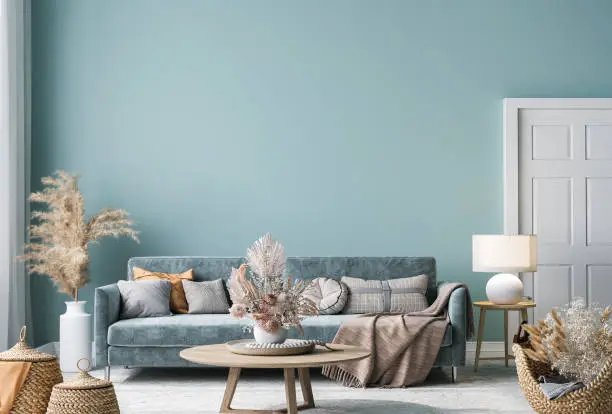 Photo of Home interior mock-up with blue sofa, wooden table and decor in blue living room