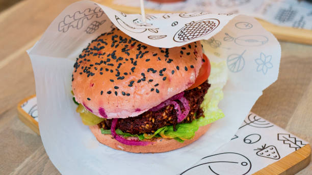 istock Vegetarian burger with beetroot patty 1300129460