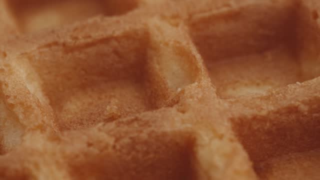 Vienna waffles. Pastry. Baking background. Shot with a shallow depth of field. Сlose-up macro, selective focus. Spinning. 4K video