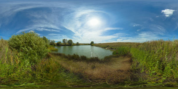 istock Summer landscape with field and lake. 360-Degree view 1300131690