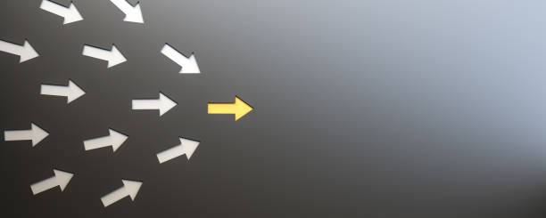 istock Leadership concept, yellow leader arrow leading white arrows, on black background with empty copy space on right side 1300131744