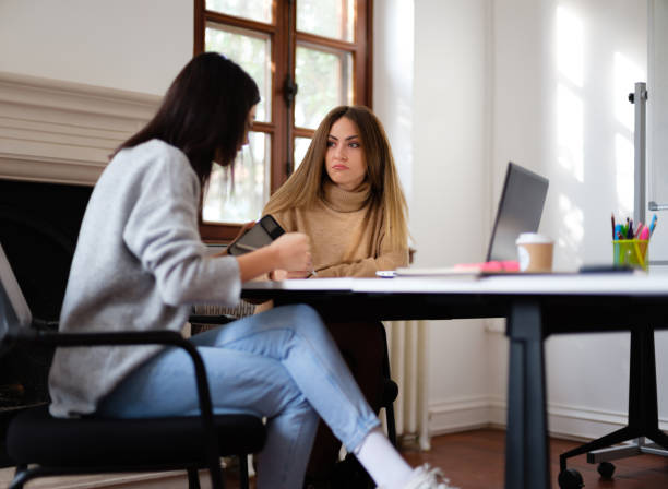 istock Businesswomen Discussing On Their Project In The Office 1300132574