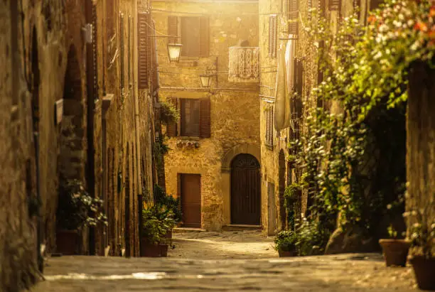 Old Narrow Italian Toscany Village Street During Hot Summer Day. North Western Italy. Pienza Region. Italian Architecture.