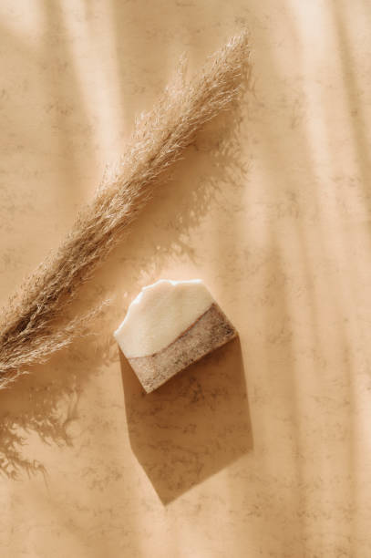 istock Handmade soap and pampas grass. Sunshade shadow on beige background. Zero waste, eco friendly cosmetics concept. Vintage color filter 1300135273