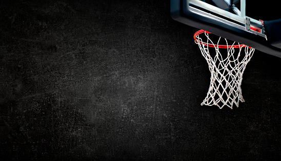 Basketball hoops against dark concrete background. Banner art concept
