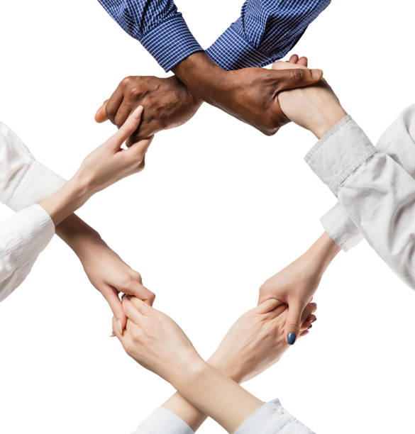 istock Group of young businessmen holding one another's hands. Unity concept. 1300136067