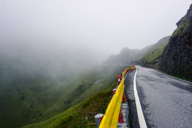 istock Mountain road in fog in Taiwan 1300140409