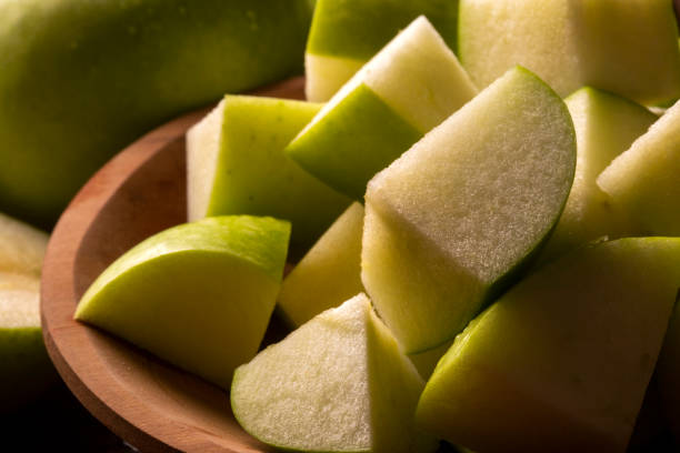 istock Ripe green apples on table close up 1300141537