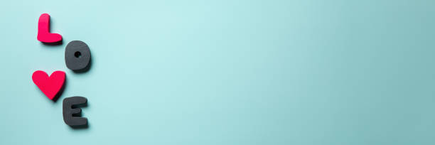 istock Word love on blue background. Valentine's day banner. Top view, flat lay, copy space. 1300141552
