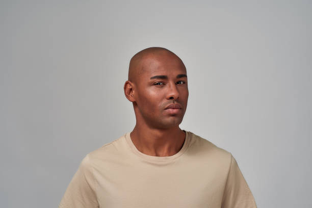 istock Man is squinting his eyes in suspicion 1300142869