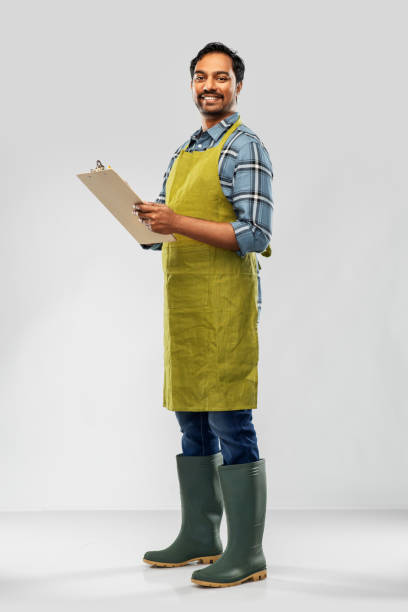 istock happy indian gardener or farmer with clipboard 1300142874