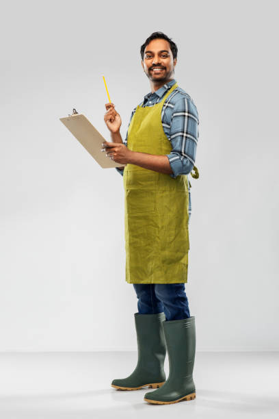 istock happy indian gardener or farmer with clipboard 1300143719
