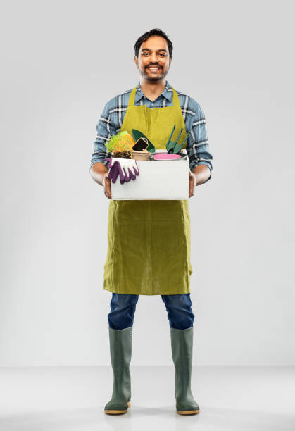 istock indian gardener or farmer with box of garden tools 1300143817