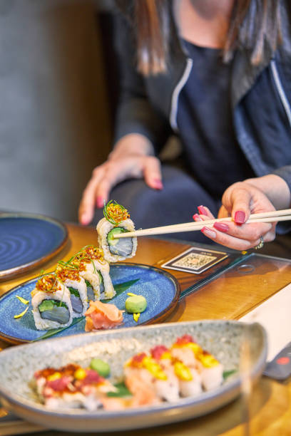 istock Celebration Sushi dinner party with friends. 1300144064