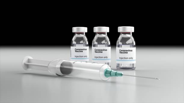 istock Syringe and Bottle on black background 1300144229
