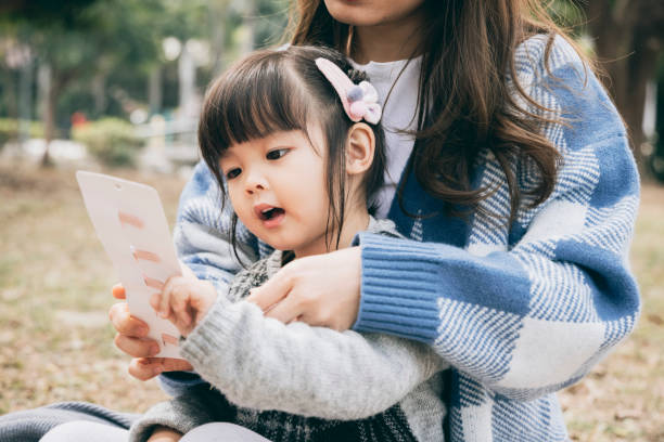 istock Mother and daughter in the park 1300144920