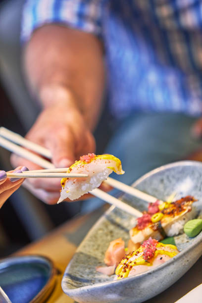 istock Celebration Sushi dinner party with friends. 1300144939