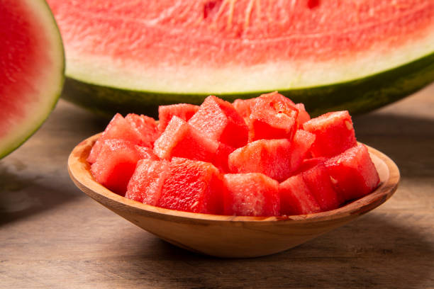 istock fresh watermelon cut into cubes on wooden bowl 1300145328