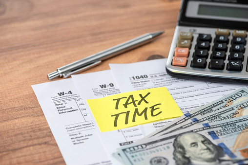 Tax Time note on tax forms. Tax concept