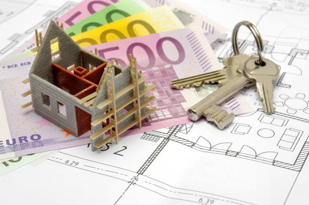 istock model home, Euro banknotes and keys laying on plan 1300148100