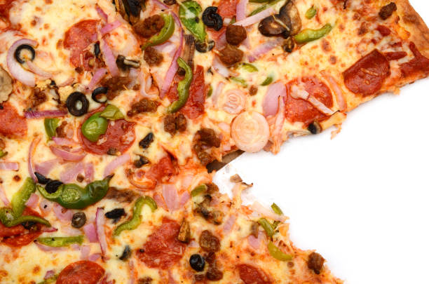 istock Closeup of combo pizza slice eating 1300149320