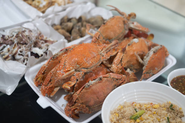 Steamed crab on the white foam box. Seafood in foam boxes