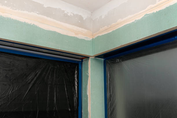 istock Installation for external roller shutters made of plasterboard inside the building, windows are covered with protective foil. 1300150813
