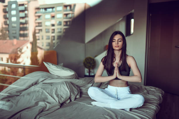 istock Female Meditating At Home 1300151859