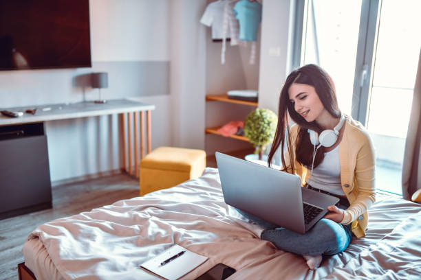 istock Modern Female Student Doing University Project In Luxurious Campus Room 1300152408