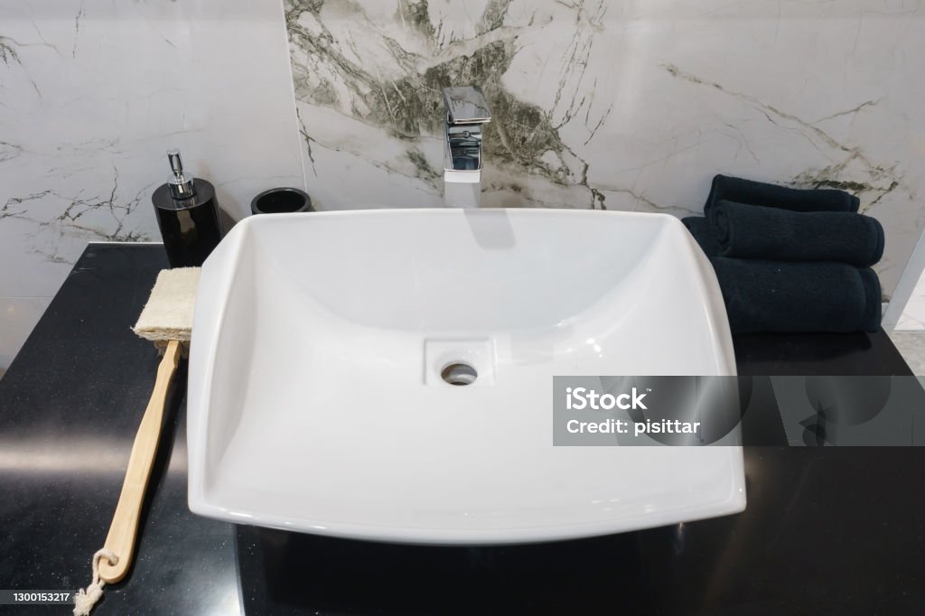 Interior of bathroom with sink basin faucet and mirror. Modern design of bathroom Apartment Stock Photo