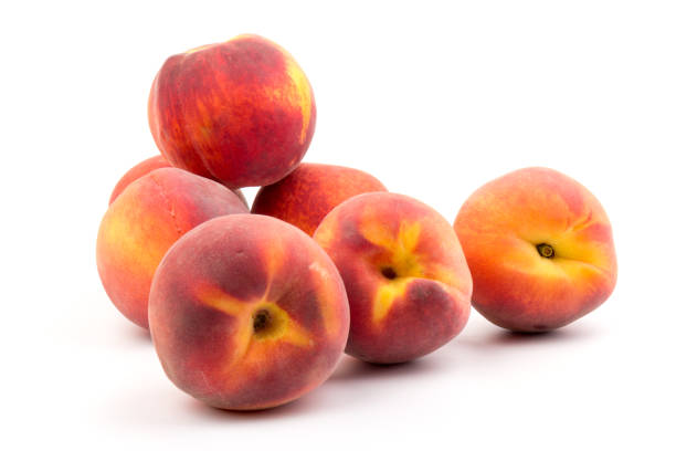 istock Summer fruit background. Ripe juicy peaches on white background. Copy space. Fresh organic fruit vegan food. Harvest concept 1300153782