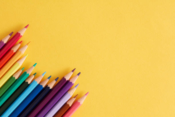 Colored pencils on the yellow background Colored pencils on the yellow background coloured pencil stock pictures, royalty-free photos & images