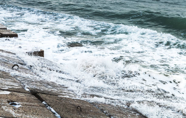 Concrete breakwater and sea water. Montazah beach