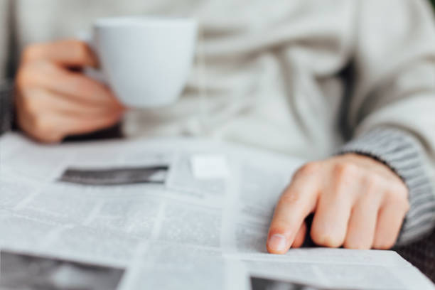 istock Close Up Of Man Reading Newspapers 1300158860