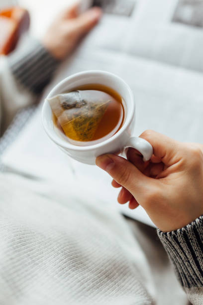istock Man Holding A Cup Of Hot Tea 1300158924
