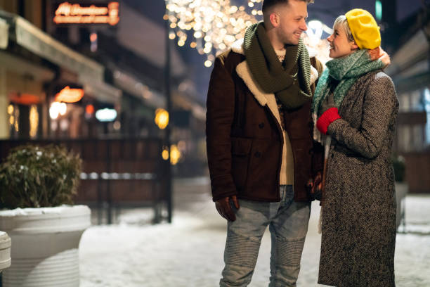 istock Loving young couple walking outdoors on a winter night 1300159116