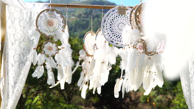Native American Dream Catchers hanging and waving in a light wind