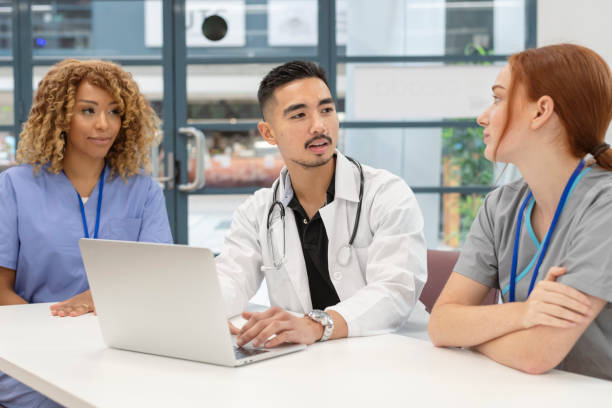 istock Multi-ethnic team of medical professionals meeting 1300161966