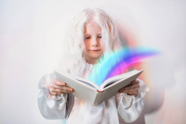 istock child imagination story time girl rainbow book 1300162061