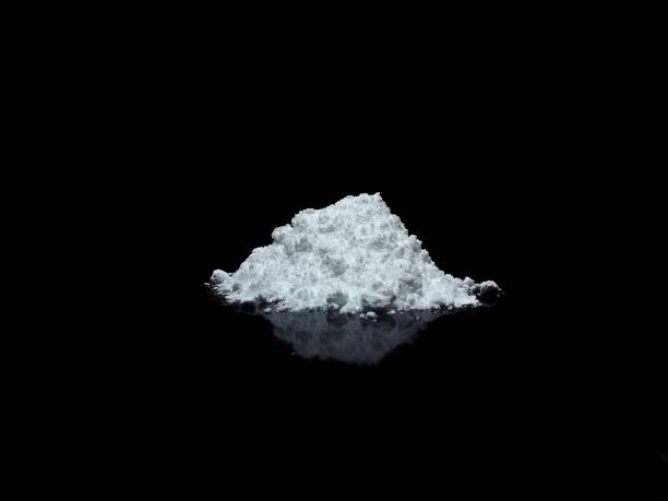 istock Cocaine drug powder on black background 1300162125