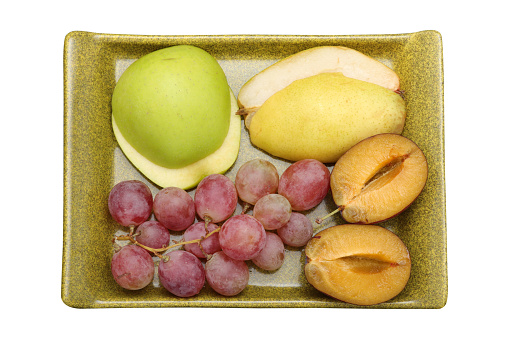 fresh fruits grape, plum, apple, pear in the plate