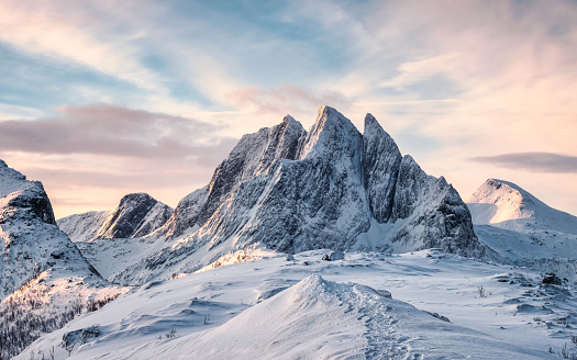 Scenery of Majestic snow mountain with footprint on Segla hill in the morning at Senja Island, Norway