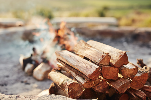 Shot of a log fire in an outdoor fireplace