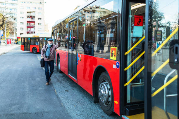 istock Mature Businessman Running To Catch Bus Stop 1300168323