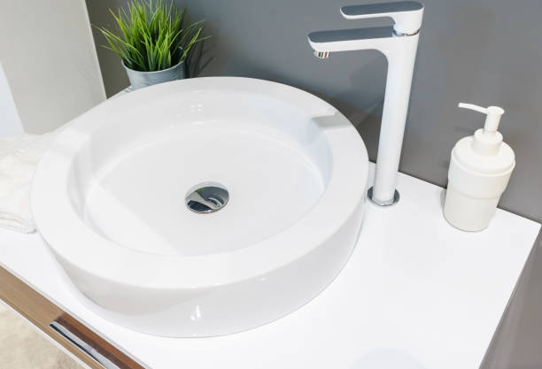 istock Bathroom interior with sink and faucet. 1300168535